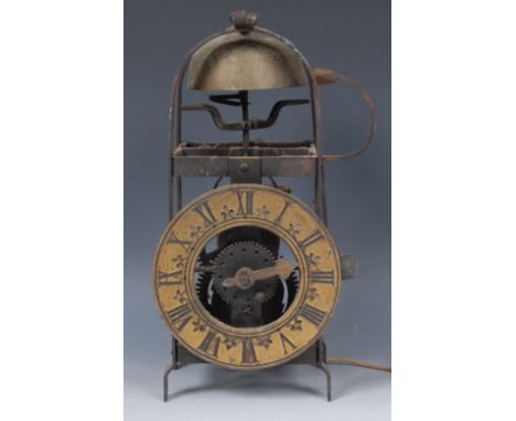 A 19th century lantern clock, 14.5cm circular brass dial inscribed with Roman numerals, iron frame, the movement striking on 