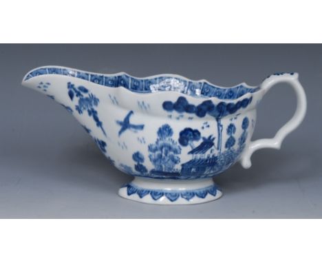 A Bow sauceboat, painted in underglaze blue with a house in Chinese landscape, the interior with peony, cell border, scroll h