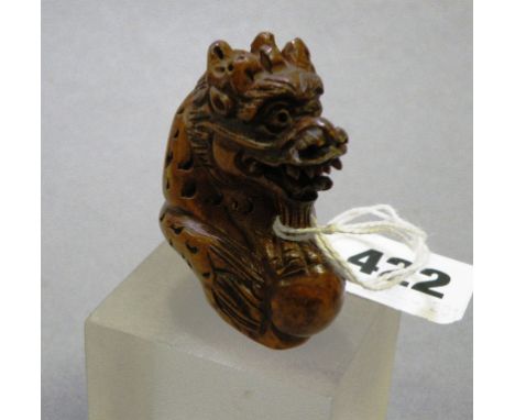 Signed wood Netsuke of a Dragon spitting Pearl