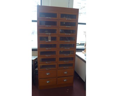 A 20th century light oak drapers cabinet with twenty drawers. H-195 W91 D-52cm 