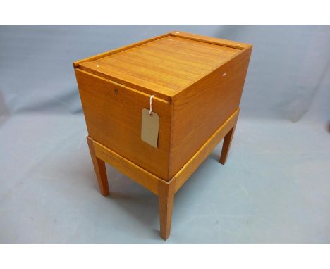 An early 20th century light oak tambour top filing box raised on stand with tapered legs. H-68 W-40 D-61cm 
