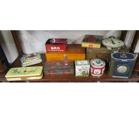 Shelf of vintage advertising tins etc