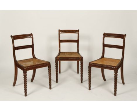 A SET OF SIX REGENCY BAR-BACK DINING CHAIRS, with bobbin-applied rails, cane seats and bobbin-turned front legs (6). Provenan