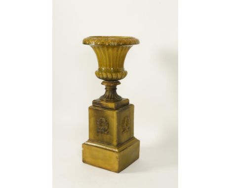 A LARGE CERAMIC JARDINIÈRE ON STAND, of broad fluted design on a stepped neo-classical square base, 42" high. See illustratio