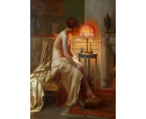 •DELPHIN ENJOLRAS (1857-1945) A semi-nude lady seated beside a lamp in a boudoir, signed lower left, oil on canvas, 28.5" x 2