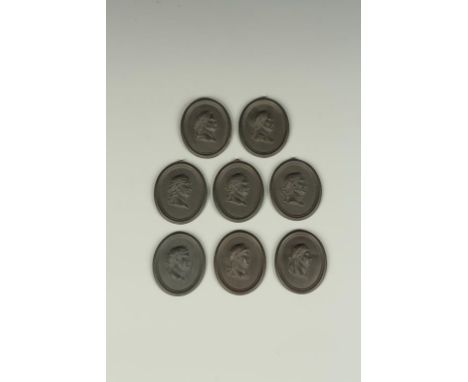 A SET OF EIGHT WEDGWOOD BASALT PORTRAIT PLAQUES OF EMPERORS including Nero, Claudius and others, each 1.25" wide (8). See ill