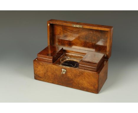 A VICTORIAN BURR WALNUT TEA CADDY with twin lidded compartments and glass basin, 14" wide.