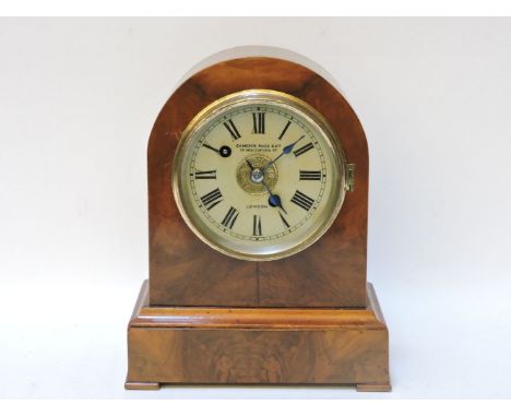 A Victorian walnut clock, by Camerer Kuss & Co, with alarm striking on a bell, 24cm high