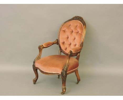 A Victorian walnut button back open armchair, 64cm wide