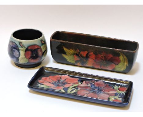 A Moorcroft 'Hibiscus' planter, a dish, and a small 'Pansy' vase