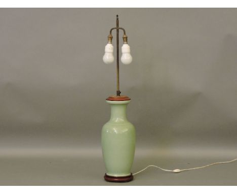 A large celadon glazed table lamp, with silk shade, a Chinese famille rose bowl, with six character mark to the base, an Isni