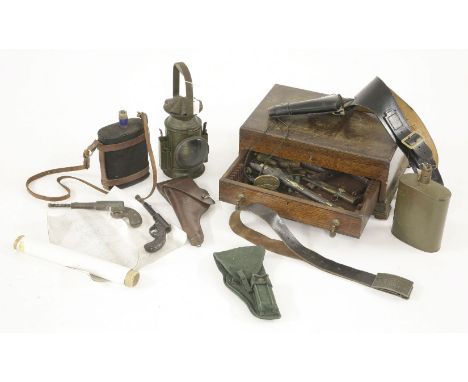 A US brown leather holster, stamped to rear ‘G & K 1918 A G’, two water canteens, one stamped ‘Anglo 1950’, a military issue 