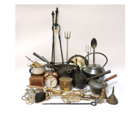 A collection of metal ware, including a cast iron kettle, saucepans with crow's foot mark, mahogany tea caddy, fireside imple