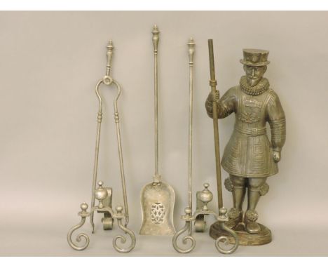 An iron 'beefeater' companion set, with three fire tools and two dogs, 71cm high