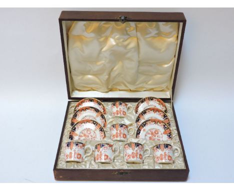 A cased set of six Imari pattern 2712 coffee cans, and saucers