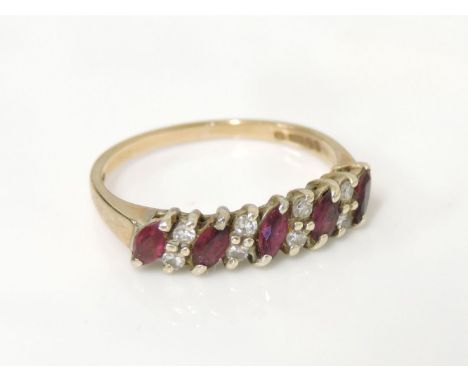 A 9ct gold five stone diagonal marquise cut half hoop ruby ring, set with eight diamond points, with original F Hinds certifi