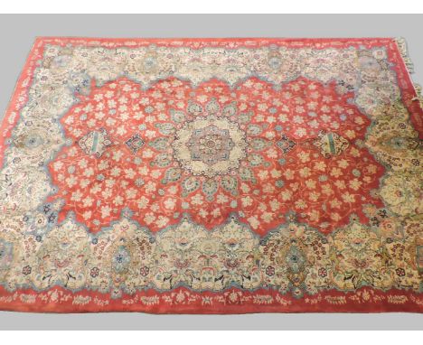 A large Kashan red ground carpet, 392 x 262cm