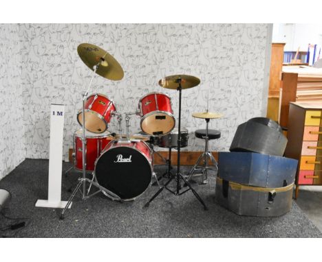 A Pearl drum kit with Paiste cymbals along with stool, pedals and transport cases. 