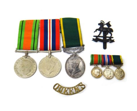 The 1939-45 Defence Medal, The 1939-45 War Medal and The Efficiency Medal, George VI issue, with bar Territorial to 6089473 W