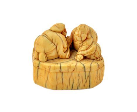 A Japanese ivory netsuke of Ebisu and Hotei arm wrestling, possibly 18th century, each carved kneeling on an octagonal base, 