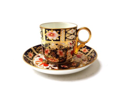 Six Royal Crown Derby coffee cups and saucers and a sugar bowl, circa 1916, decorated in the `2451' Imari pattern, red printe