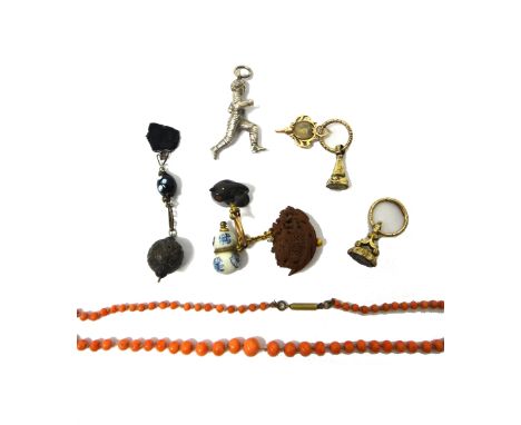 Two Victorian small fob seals, fitted to split rings, an 18th century watch key mount, glazed with the portrait miniature of 