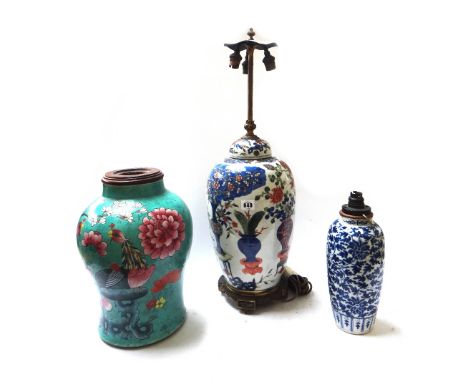 A Chinese famille rose porcelain vase and cover fitted as a table lamp, on a wooden stand, 38cm high, a Chinese blue and whit