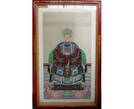 A Chinese ancestor portrait, 19th century, gouache and gilding on paper, painted with a seated woman in dragon robe with a si