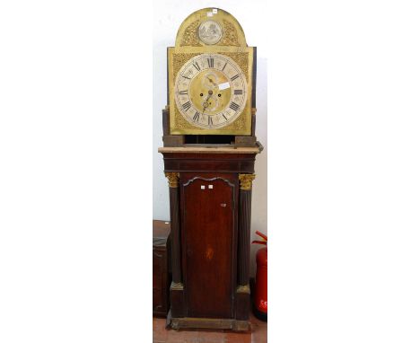 A George III eight day oak and mahogany inlaid longcase clock, dismantled, with brass arch top dial detailed with two subsidi