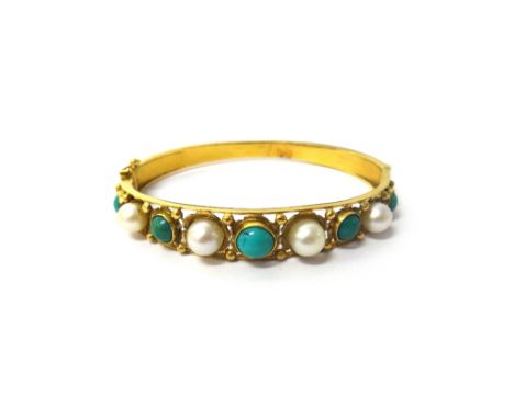 A gold, turquoise and cultured pearl set oval hinged bangle, the front mounted with cultured pearls alternating with turquois