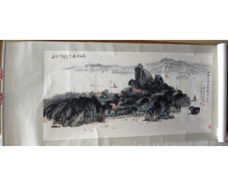 A Chinese scroll painting , depicting a rocky island with a coastline in the distance, 67cm. by 135cm., boxed.