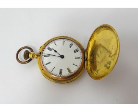 A lady's gold cased, keyless wind, hunting cased fob watch, with a gilt jewelled lever movement, gold inner case, the enamell