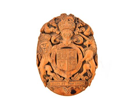 An early 20th century English carved boxwood snuff box of Charles II style, carved in deep relief with the Royal arms, motto 