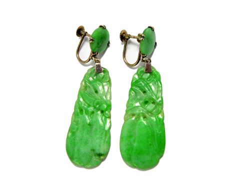 A pair of carved jade pendant earrings, each drop of tapered form, carved as fruiting motifs and with uncarved circular surmo