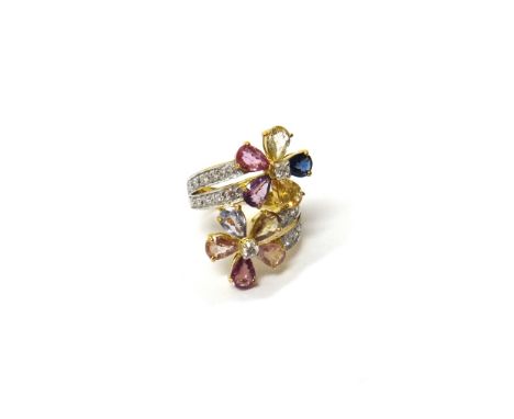 An 18ct gold, diamond and vary coloured gemstone set ring, designed as two flowerheads, each centred by a circular cut diamon