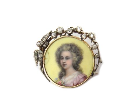 A gold mounted and silver set diamond and enamelled brooch, the centre with the circular enamelled portrait of a lady, the bo