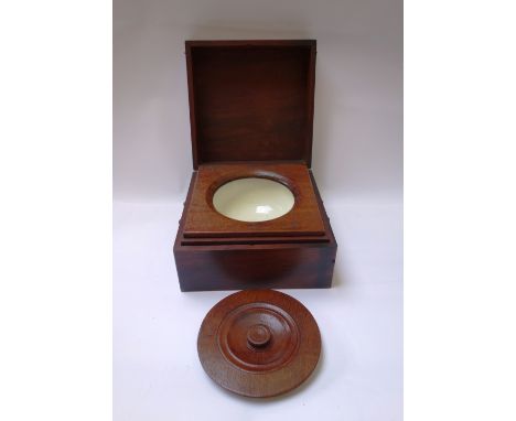 A George III mahogany travelling shaving bowl/commode with lidded ceramic lined interior, 33cm wide. 