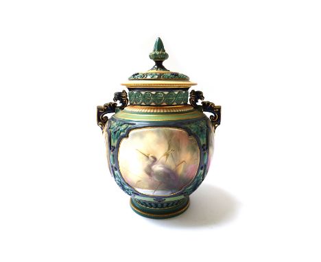 A Hadleys Worcester porcelain pot pourri two handled vase and cover, late 19th century, decorated with four panels of wild bi
