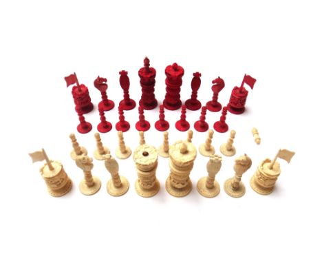 A Cantonese stained ivory chess set, 19th century, of carved foliate form (a.f), 10cm high. (32)