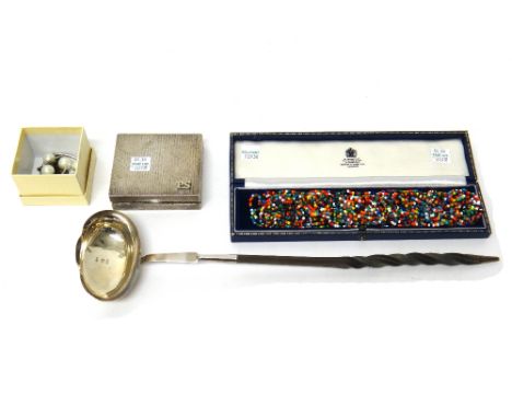 A silver rectangular cased calculator, having a bark textured finish, London 1977, a silver toddy ladle, having a twisted wha