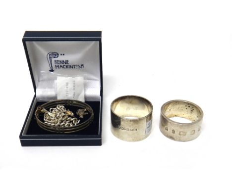 Silver, comprising; two napkin rings, including Birmingham 1965, an oval hinged bangle, in a design after Rennie Mackintosh, 