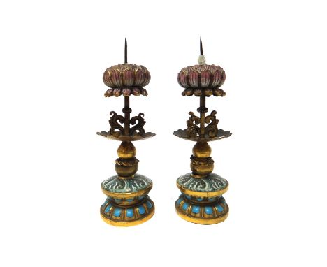 A pair of Chinese gilt-metal and enamel pricket candlesticks, circa 1900, each with a cloisonné and turquoise enamelled base 