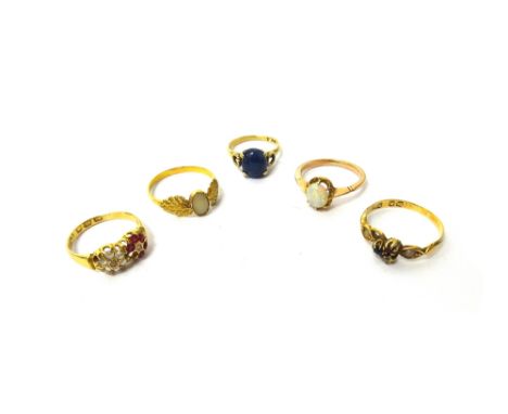 An 18ct gold, rose diamond and ruby set ring, in a twin cluster design, (one ruby lacking), a gold ring, claw set with an ova