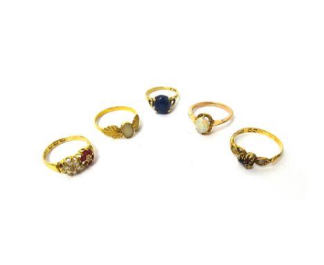 An 18ct gold, rose diamond and ruby set ring, in a twin cluster design, (one ruby lacking), a gold ring, claw set with an ova