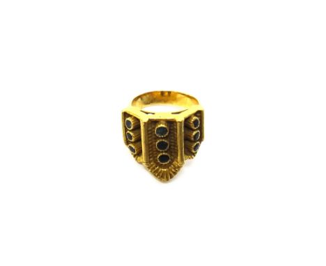 A gold and gem set ring, in a triptych panel shaped design, detailed A 21 750, ring size K, gross weight 12.1.gms.