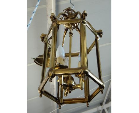 A pair of modern Georgian style gilt brass hall lanterns, of hexagonal form, with shaped overtier, internal three light fitme