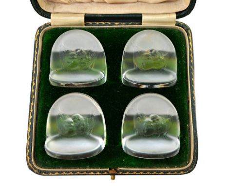 A set of four Lalique 'Pinsons' clear and frosted glass menu holders, designed in 1924, relief moulded with chattering birds,