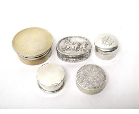 A silver circular box and cover, having engine turned decoration, Birmingham 1928, a silver oval hinge lidded pill box, the c