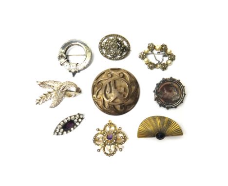 A gold, amethyst and seed pearl set pendant brooch, pierced in a quatrefoil shaped design, detailed 9 CT and eight further br
