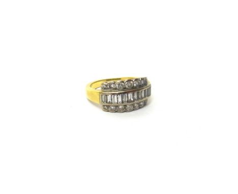 A gold ring, mounted with a row of baguette diamonds to the centre, between diamond set sides, each side mounted with a row o